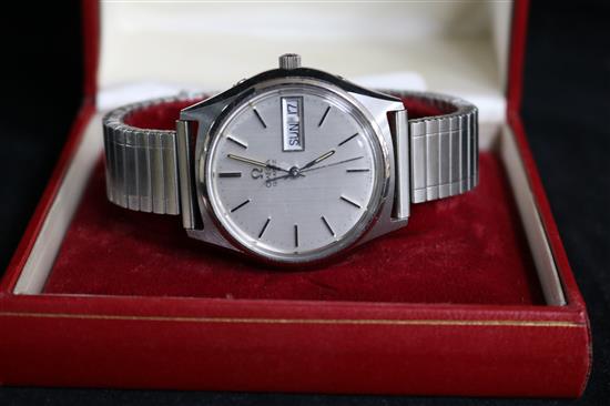 A gentlemans stainless steel Omega quartz wrist watch with day/date aperture and Omega box.
